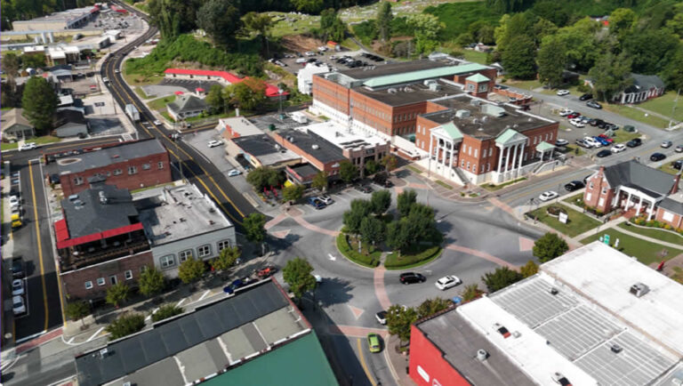Aerial view of small town buildings and roundabout